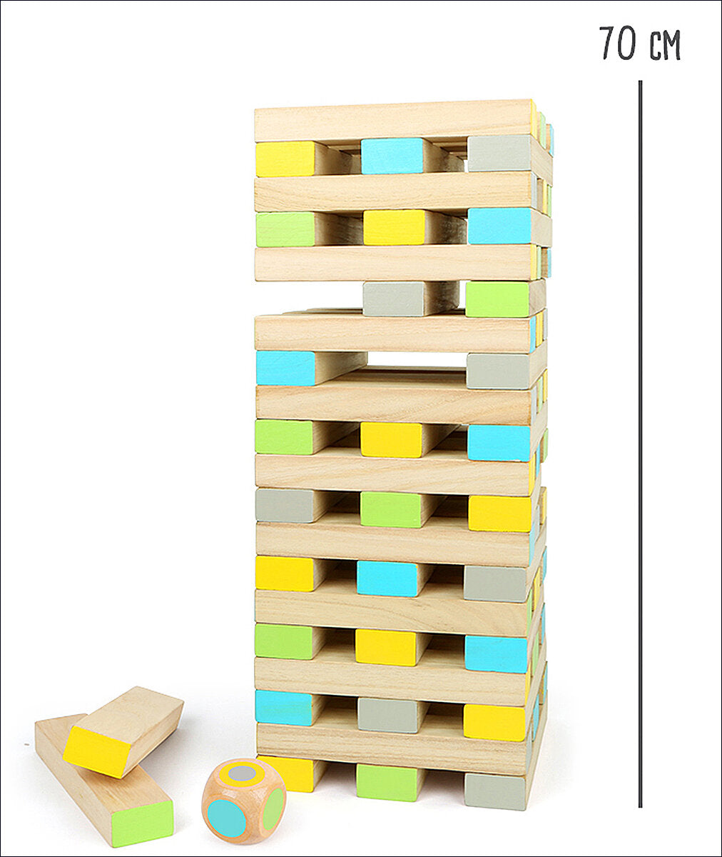 Holz-Jenga-Turm mit bunten Steinen, Höhe 70 cm, daneben einige Steine und ein Würfel.
