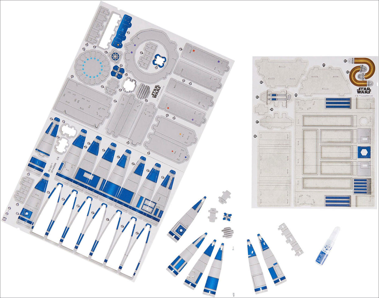 Star Wars Modellbausatz mit blauen und weißen Teilen, Bauanleitung und Klebstoff.