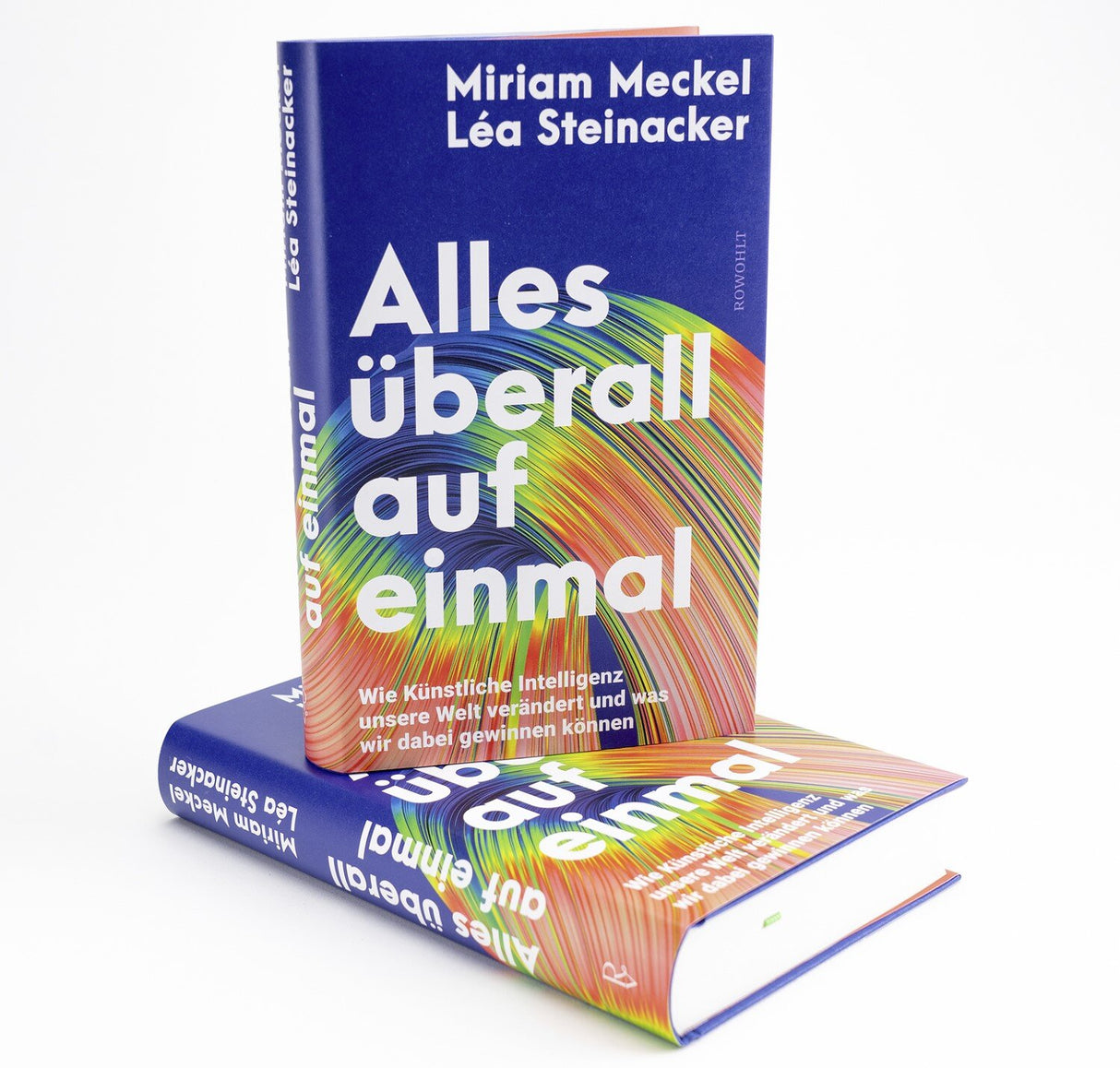 Zwei Bücher mit buntem, spiralförmigem Design und weißen Schriftzügen, eines steht auf dem anderen.
