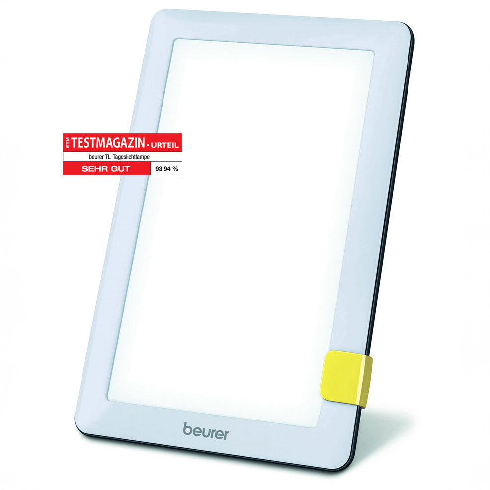 Elektrische Tageslichtlampe mit weißem Rahmen, gelbem Schalter, Beurer-Logo, Testurteil 93,94 % "Sehr Gut".