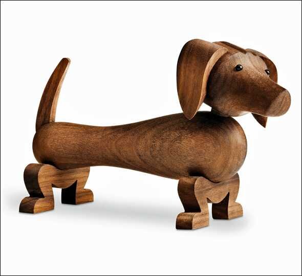 Holzfigur eines Dackels mit beweglichem Körper, Kopf, Ohren, Schwanz und Beinen.