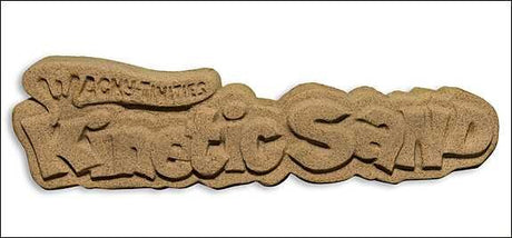 Keks in Form eines Schriftzugs mit dem Text "WAS GESCHENK" und zusätzlicher kleiner Schrift darüber.