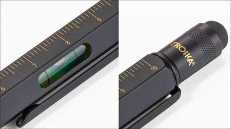 Bild mit einem schwarzen Messgerät und einem schwarzen Messinstrument, beide mit goldenen Markierungen.