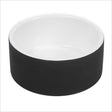 Schwarze Schale mit weißem Inneren, runde Form, auf weißem Hintergrund.