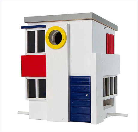 Vogelhaus im Bauhaus-Stil mit weißen, roten, blauen und gelben Elementen, rechteckigen Fenstern und runden Öffnungen.
