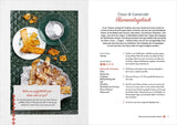 Bunte frittiertes Carnevalgebäck auf Papier und Teller, mit Salz, Zucker und einem Glas Wasser.