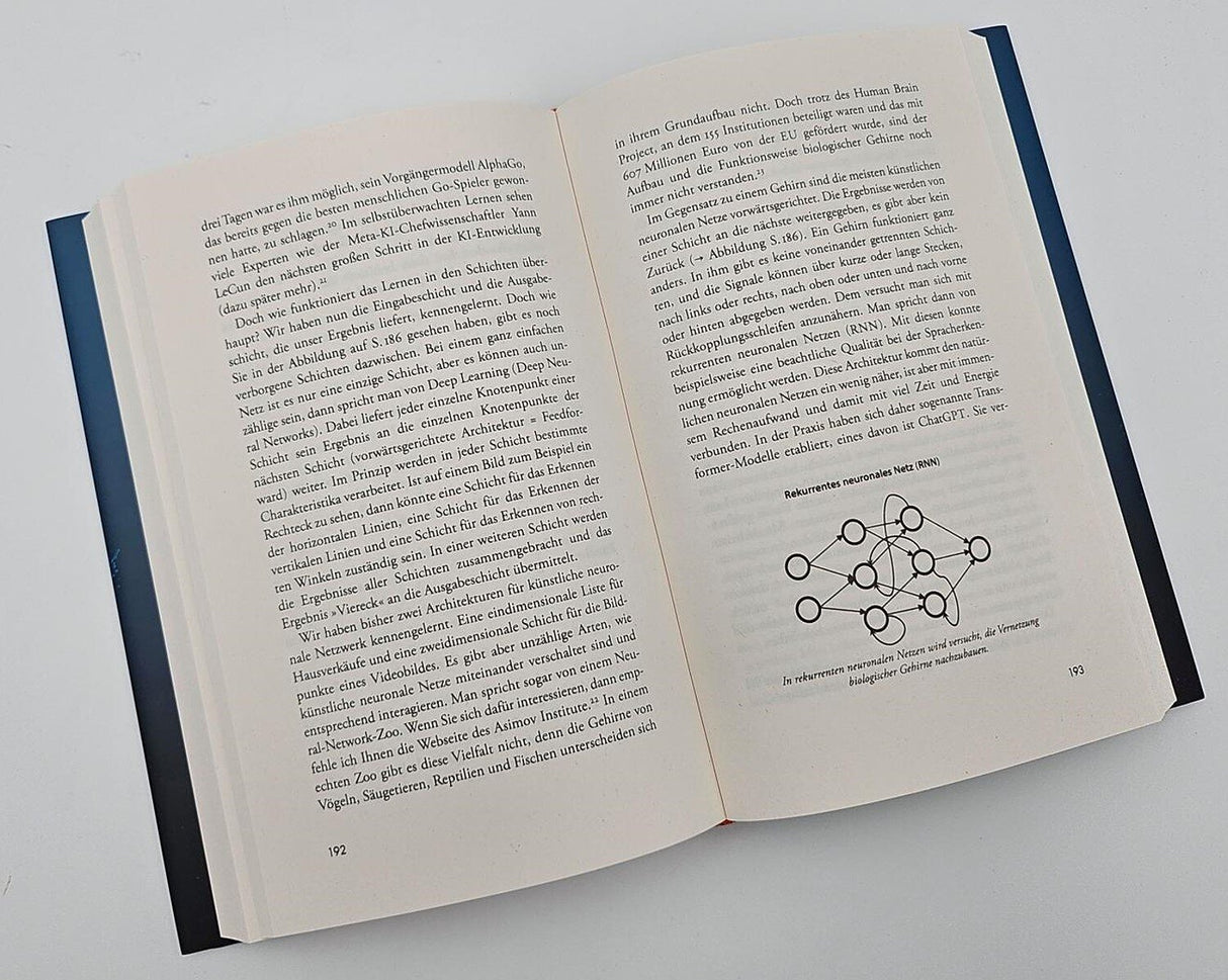 Offenes Buch mit Text und Diagramm über rekurrente neuronale Netze (RNN).