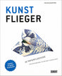 Buchcover mit Titel "Kunst Flieger", Bild eines gefalteten Papierfliegers mit Kunstwerken inspiriert.