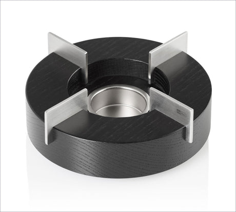 Runder schwarzer Gummiring mit vier Metallstegen und zentralem Metalllager.