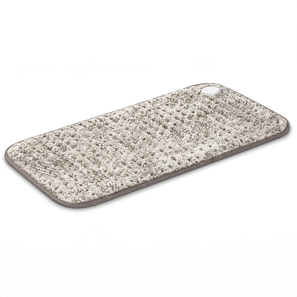 Waschbarer, flauschiger Teppich mit runder Steuerungseinheit in der Ecke.