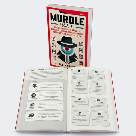 Buch mit Titel "Murdle Vol. 1" und offenes Heft mit Rätseln und Beschreibungen.